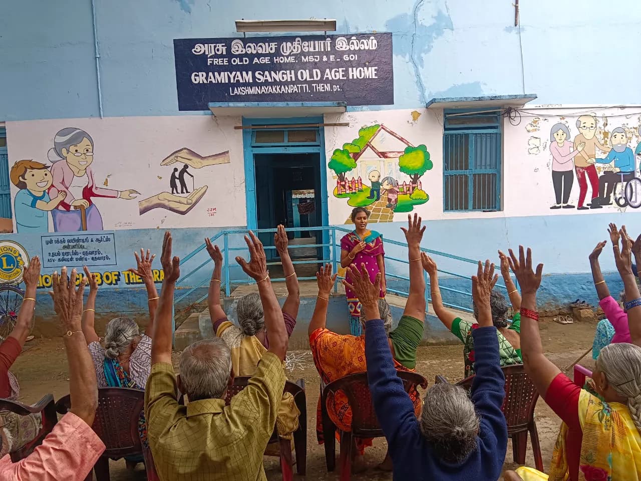 Elders practising yoga with raised arms